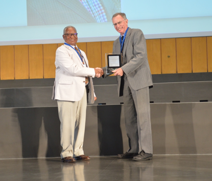 Prof Youdeowei receiving the IPPAD Award from Professor Geoff Norton, President of the International Association of Plant Protection Sciences in Berlin, Germany, August 2015. Photo: IAPPS
