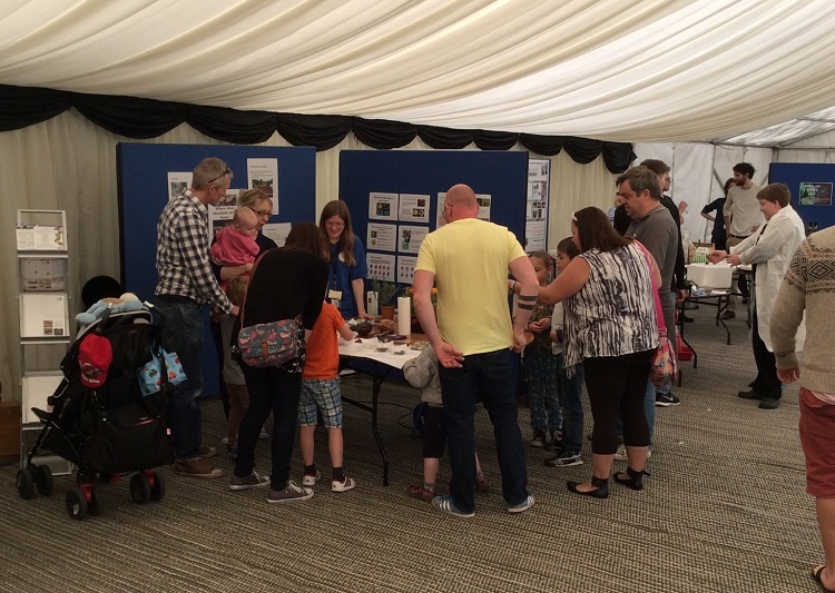 NRI's Sarah Arnold at FoPD, enticing the crowds with a sumptuous selection of chocolate, cocoa pods and more. Photo: P Burt