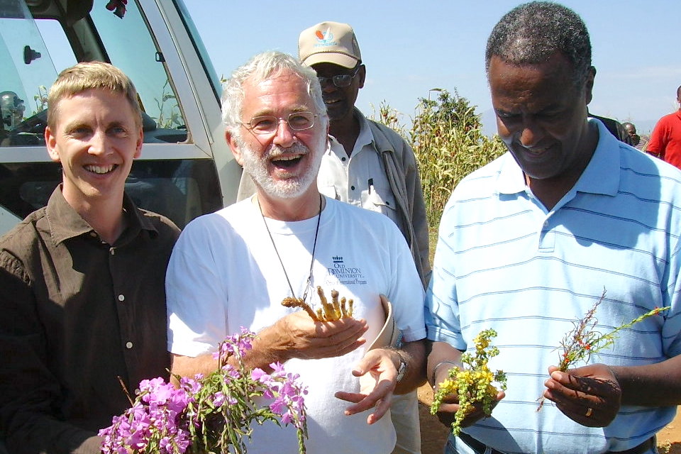 Co-authors Jonne Rodenburg (L) and Lytton Musselman (C) holding parasitic plants in Ethiopia in 2006