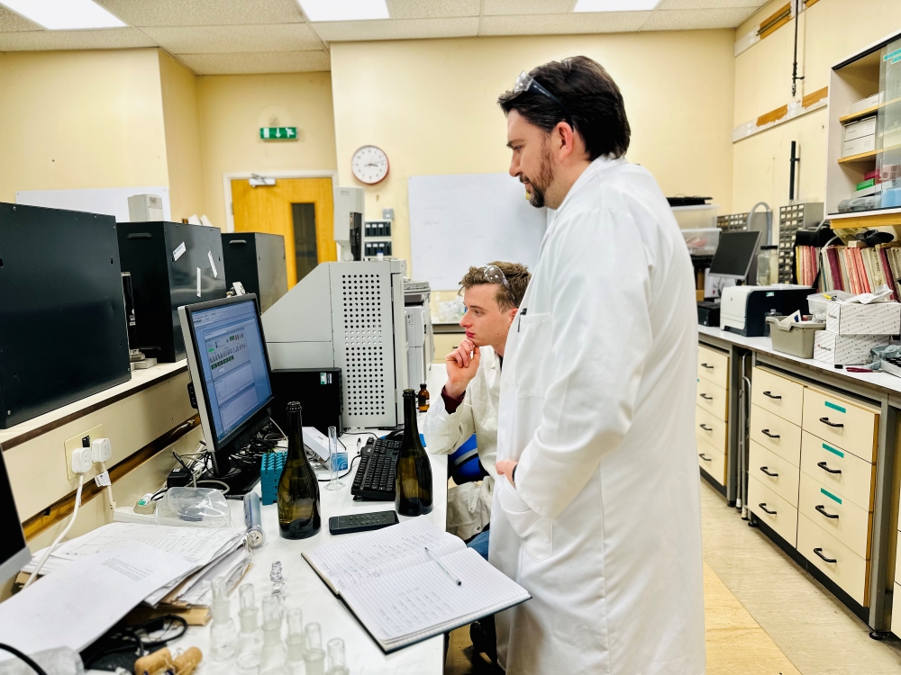NRI's Dr Steve Harte (standing) and Hugo Woodhouse, a student from Plumpton college analyse results from tests on wine samples in the chemistry lab at NRI