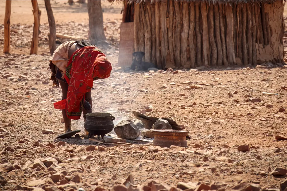 A woman preparing food in rural Namibia. Women’s diets are shaped by a complex web of structural, sociocultural, and financial and physical drivers