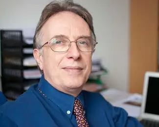 Dr John E Orchard
